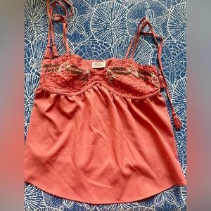 Peach coral top with tassel tie straps and stitched flower bra cups